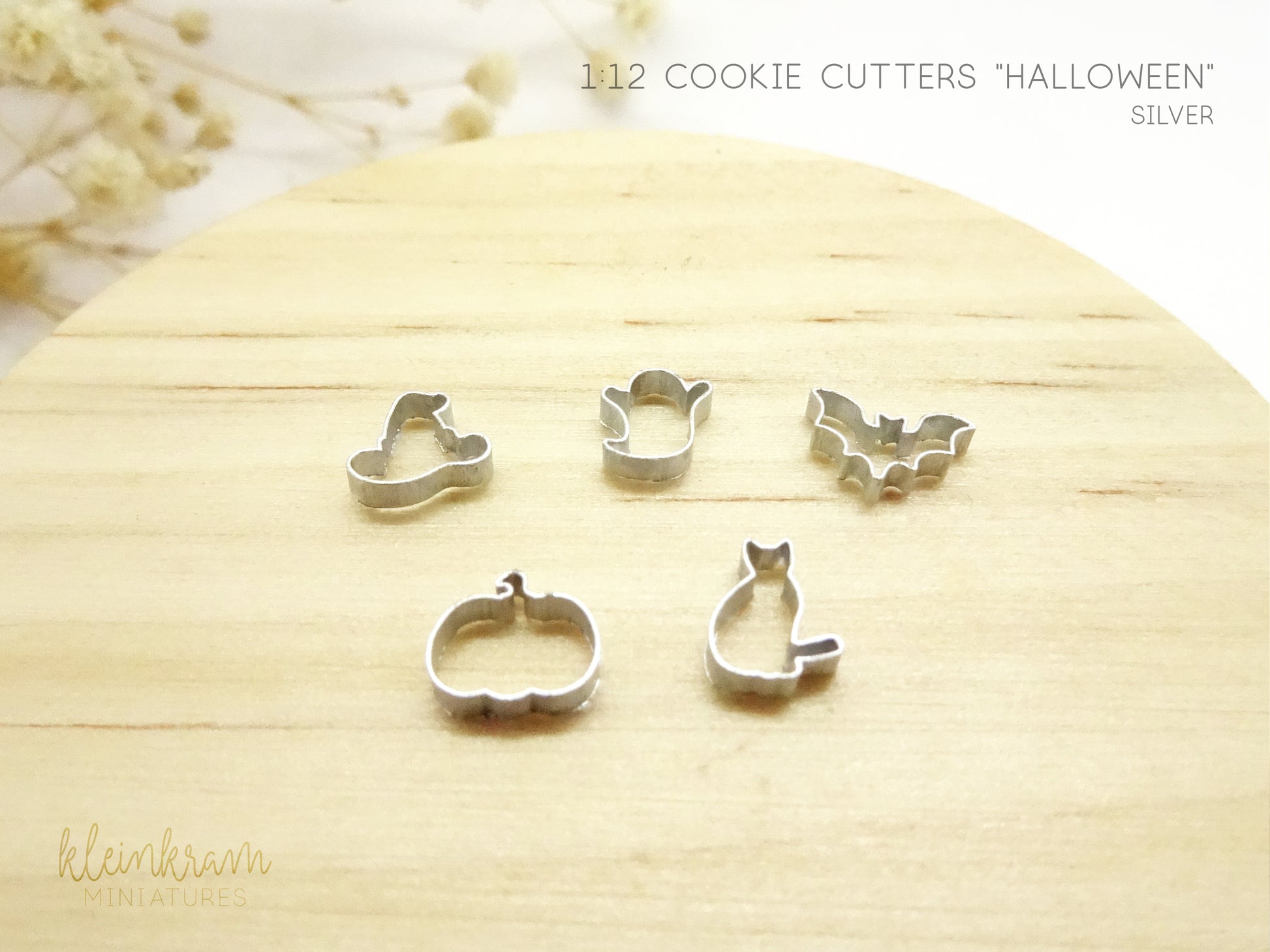 Miniature cookie cutters in 1:12 scale for decorating dollhouses, silver